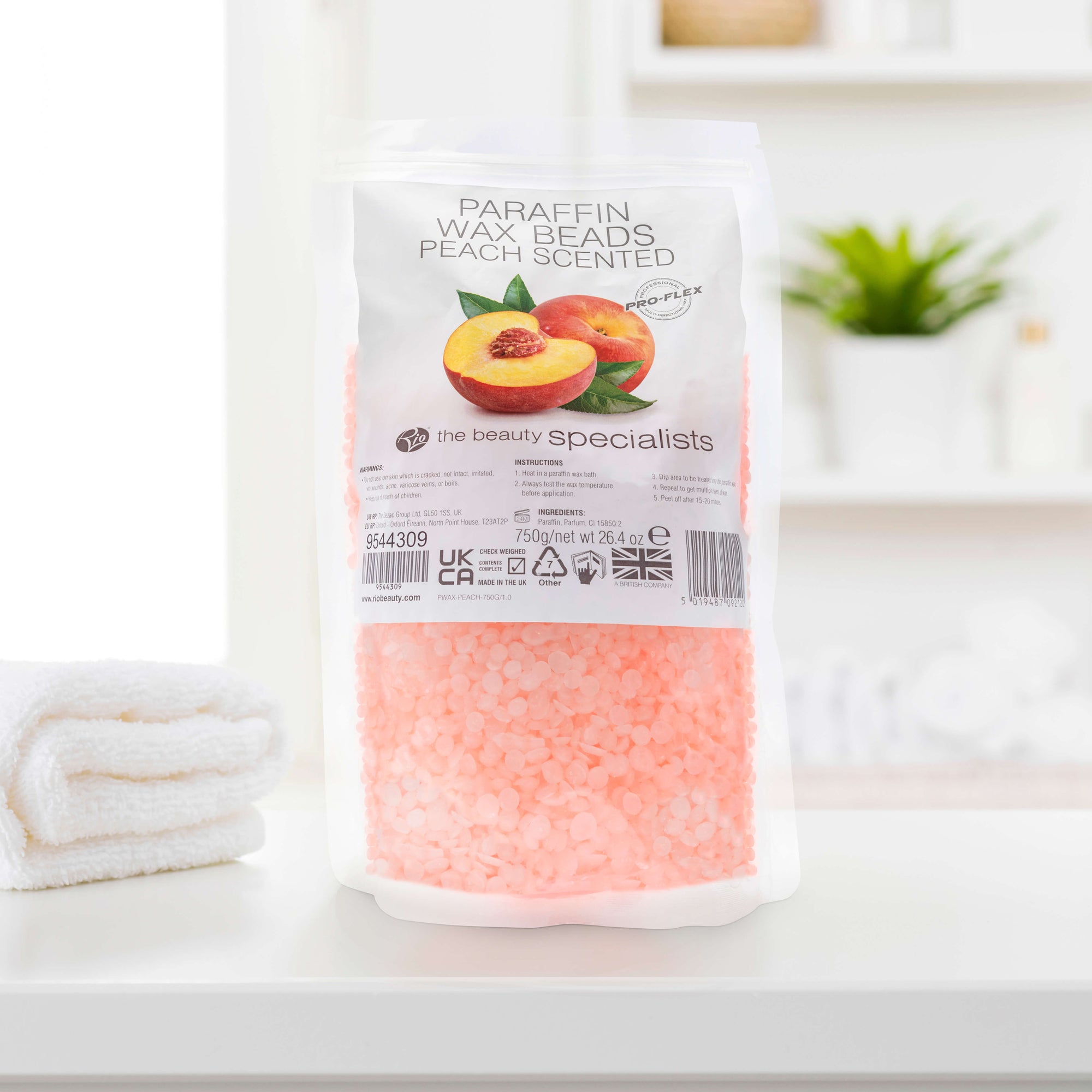 Rio Paraffin Wax Beads Peach Scented on bathroom counter