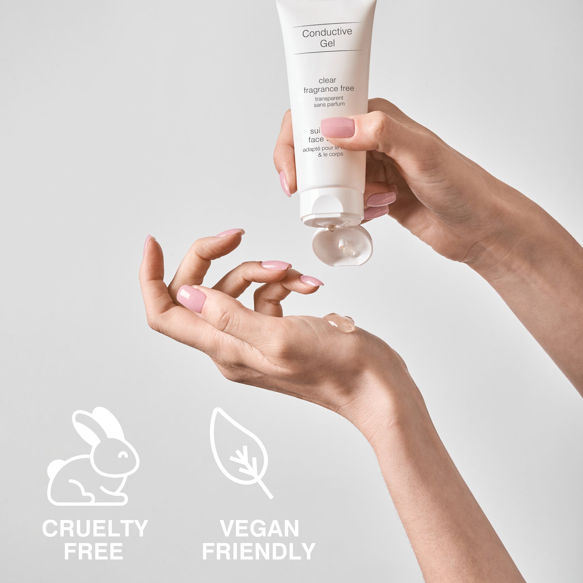 Hands dispensing clear, fragrance-free Conductive Gel from a tube. This conductivity gel is cruelty-free and vegan-friendly, perfect for use with EMS, TENS, and microcurrent devices to enhance skin and muscle stimulation treatments.